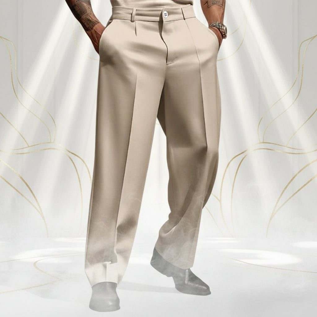 Person wearing beige pants and black shoes on a blurred street background